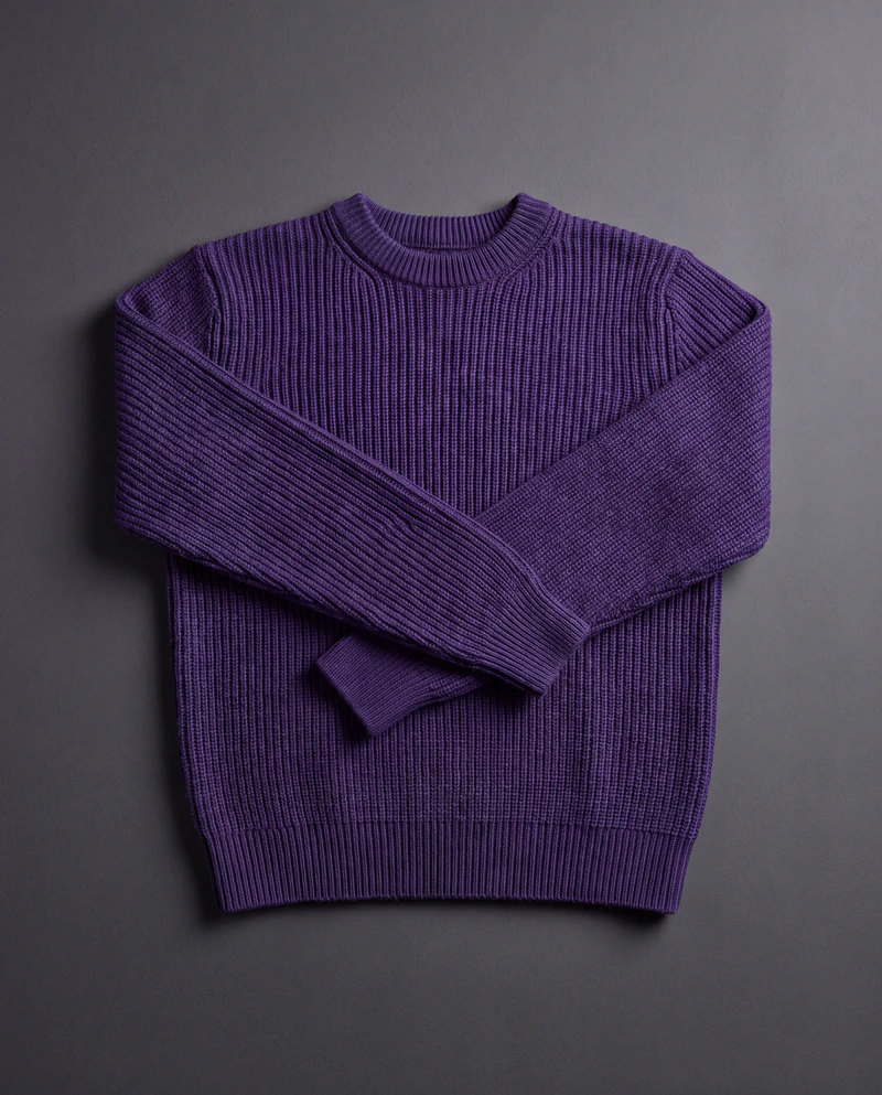 A deep violet ribbed-knit crewneck sweater laid flat