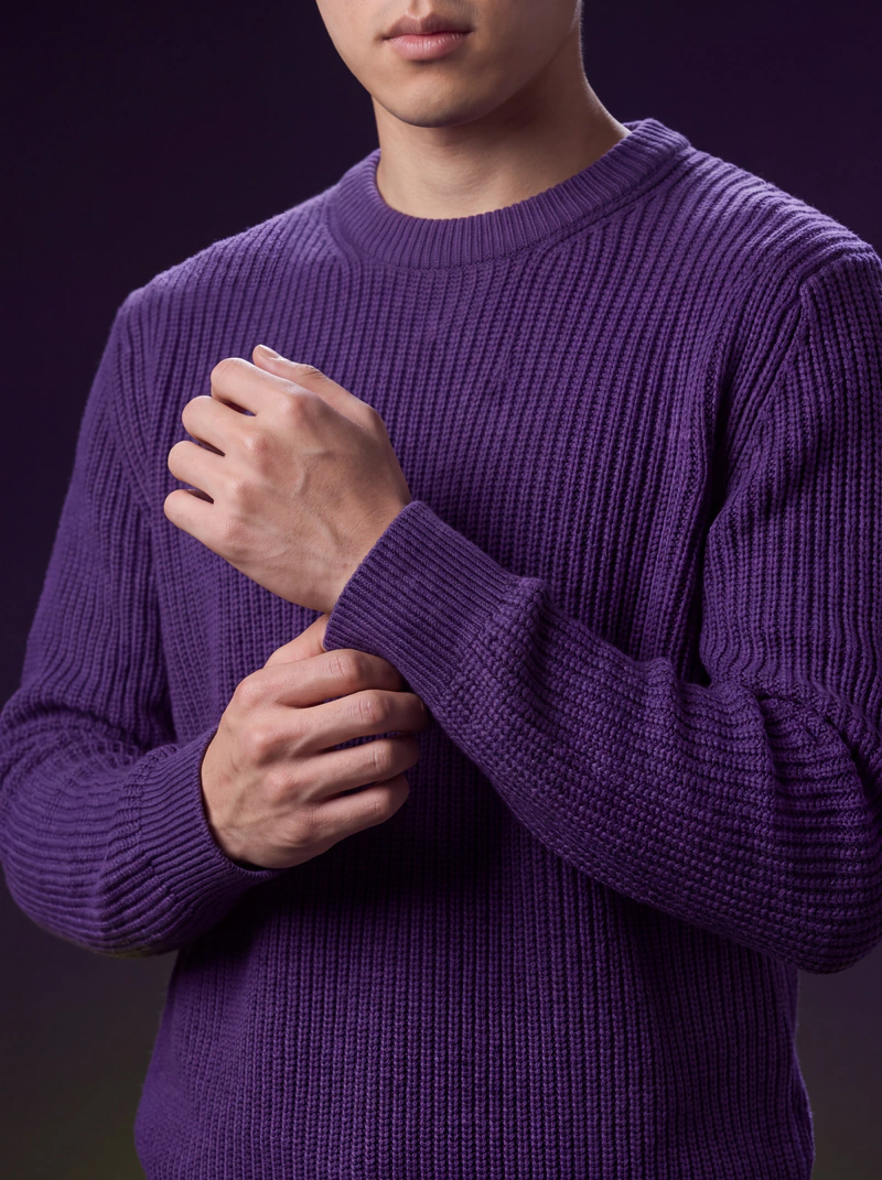 A close view of the sweater's rib knit and cuff